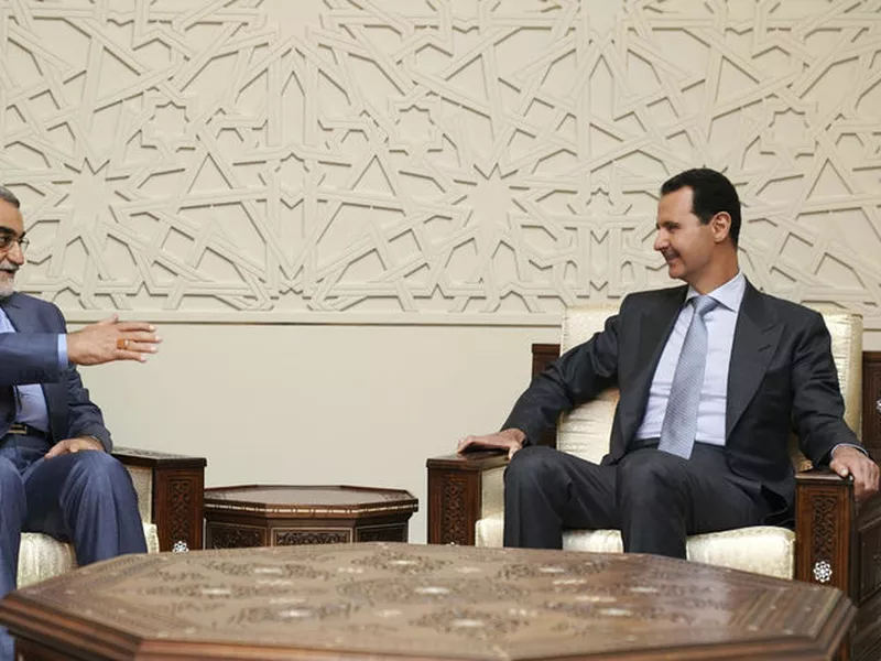 Syrian President Bashar Assad, right, meets with Alaeddin Boroujerdi, left, the head of Iran’s parliamentary committee on national security and foreign policy, in Damascus, Syria.