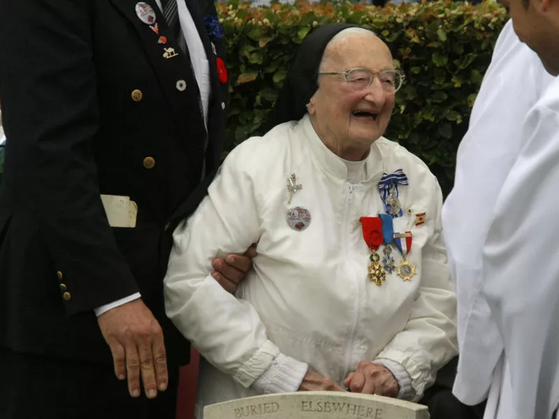 Sister Agnes-Marie Valois attends the commemorations to honor Allied
soldiers killed 70 years ago in a failed World War II invasion, which took
place at the Cemetery of Virtues in Dieppe, northern France.