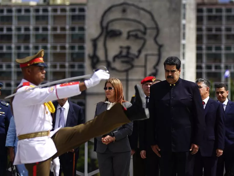 Cuban´s President Miguel Diaz-Canel, front left, escorts Venezuela’s President Nicolas Maduro during his welcome ceremony at Revolution Palace in Havana, Cuba.