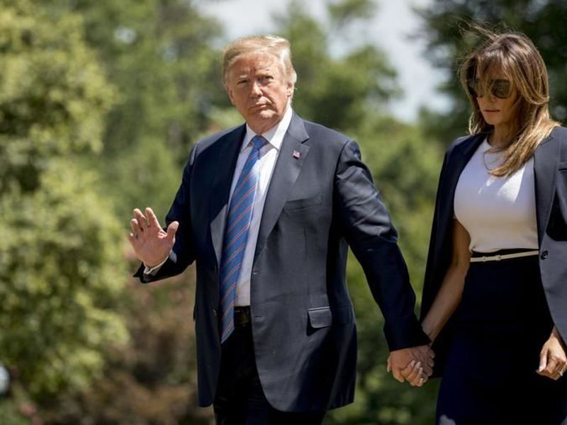 President Donald Trump, accompanied by first lady Melania Trump, as they arrive on the South Lawn of the White House in Washington. (AP)