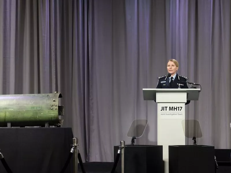 Australian Federal Police Commander Jennifer Hurst speaks as she stands near to part of a Buk missile recovered from the site of the MH17 crash. (AP)