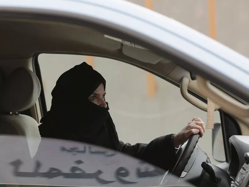 Aziza al-Yousef drives a car on a highway in Riyadh, Saudi Arabia, as part
of a campaign to defy Saudi Arabia’s ban on women driving.