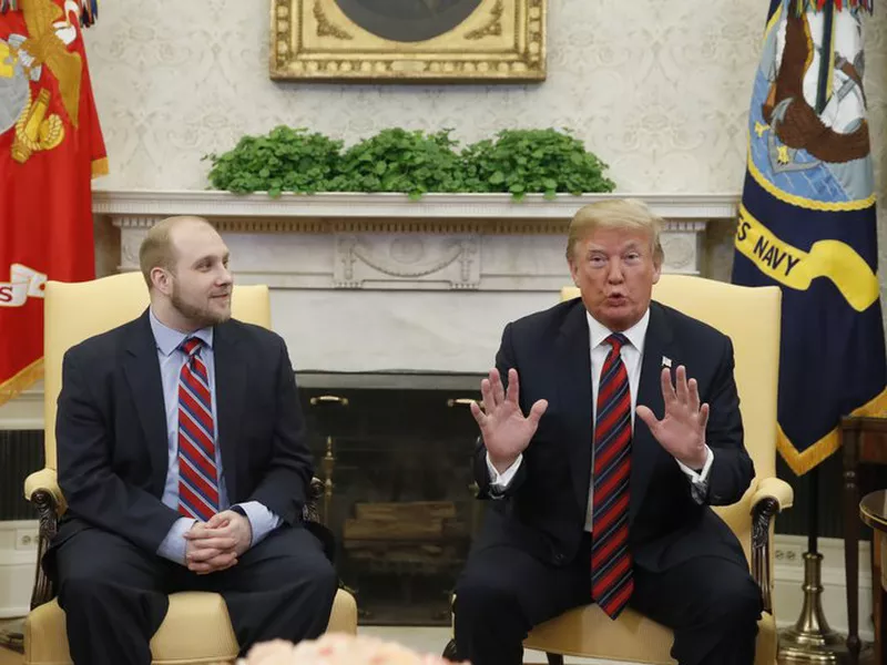 Trump, right, talks as Joshua Holt, who was recently released from a prison in Venezuela, joins him in the Oval Office of the White House, Saturday, May 26, 2018, in Washington. (AP)