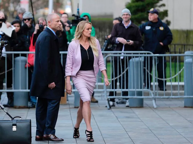 Porn actress Stormy Daniels, accompanied by her attorney, Michael Avenatti, left, leaves federal court, in New York. A federal judge is set to hear arguments about whether to delay the case of Daniels. (AP)