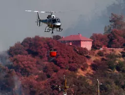 Firefighters battle wildfires up and down California