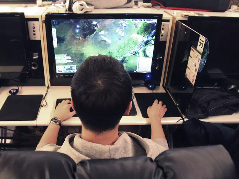 A college student plays a computer game at an Internet cafe in Seoul, South Korea. The World Health Organization said that compulsively playing video games now qualifies as a mental health condition.