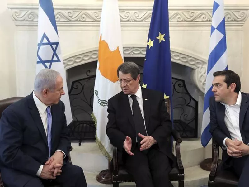 Cyprus’ President Nikos Anastasiades, center, talks with Israeli Prime Minister Benjamin Netanyahu. (AP)