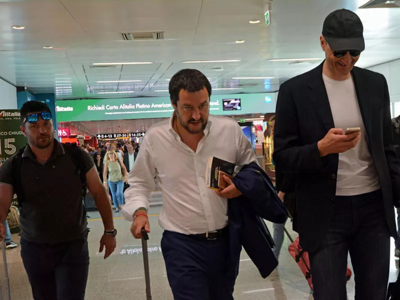 The League leader Matteo Salvini, center, arrives at Fiumicino airport near Rome.