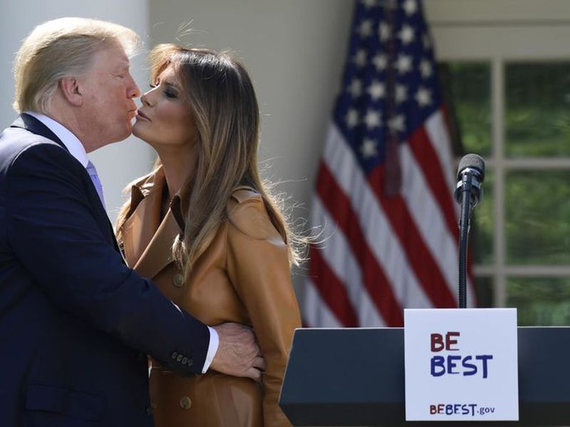 President Donald Trump kisses first lady Melania Trump following an event where Melania Trump announced her initiatives in the Rose Garden of the White House in Washington.