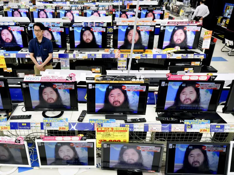 TV screens at an electrical appliance store show the image of doomsday cult leader Shoko Asahara. (AP)