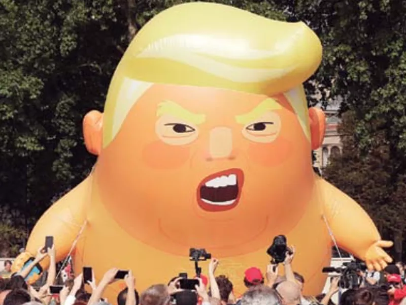 A six-meter high cartoon baby blimp of u.s. President Donald trump is flown as a protest against his visit, in Parliament square in London, England. (AP)