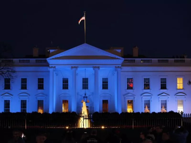 The White House is lit with blue lights in honor of World Autism Awareness Day in Washington.