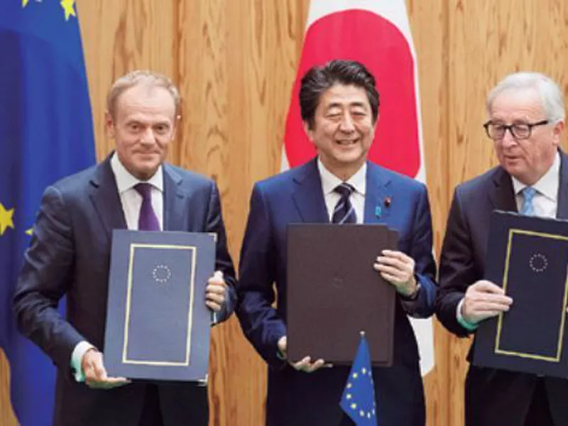 Japanese Prime Minister Shinzo Abe, center, European Union’s Council President Donald Tusk, left, and European
Union’s Commission President Jean-Claude Junker pose after signing a contract, at the prime minister’s office in Tokyo. (AP)