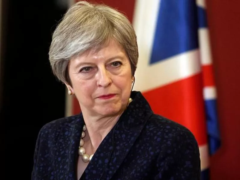 British Prime Minister Theresa May looks on during a news conference.