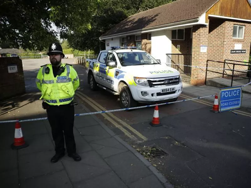 A British police officer guards a cordon which was extended overnight to include the Lush House car park adjacent to the Queen Elizabeth Gardens park, in Salisbury, England. (AP)