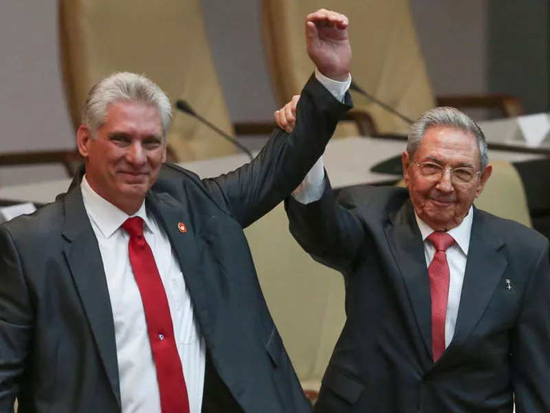 Cuba’s outgoing President Raul Castro, right, and new President Miguel Diaz-Canel raise their arms in unison at the National Assembly in Havana, Cuba. Castro said Thursday that he expected the 57-year-old Diaz-Canel to serve two five-year terms as president and eventually take Castro’s place. (AP)
