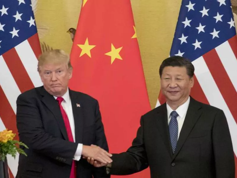 President Donald Trump and Chinese President Xi Jinping shake hands during a joint statement to members of the media Great Hall of the People in Beijing, China.