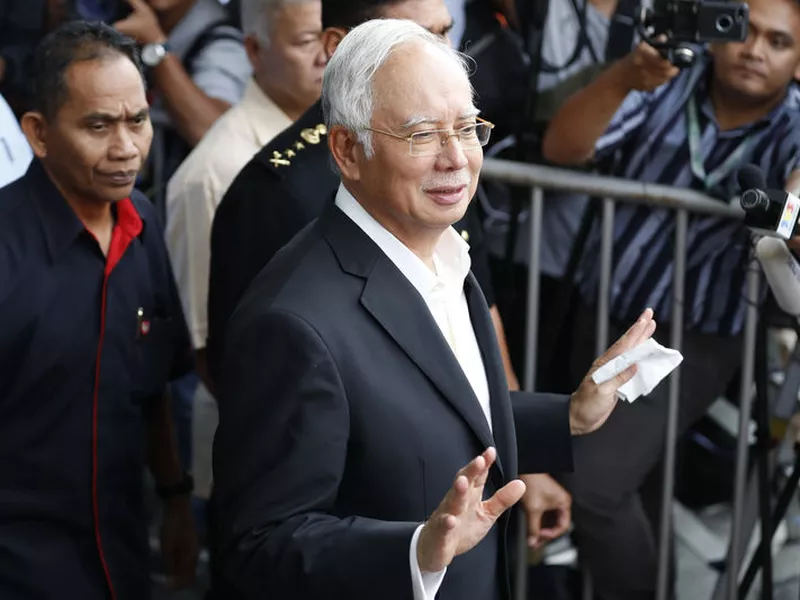 Former Malaysian Prime Minister Najib Razak, center, speaks to media as he leaves the Malaysian AntiCorruption Commission (MACC) Office in Putrajaya in Kuala Lumpur, Malaysia.