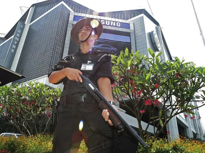 A Gurkha police officer stands guard outside the venue of the IMF-World Bank meetings in Singapore.