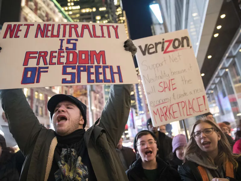 Demonstrators rally in support of net neutrality outside a Verizon store in
New York.