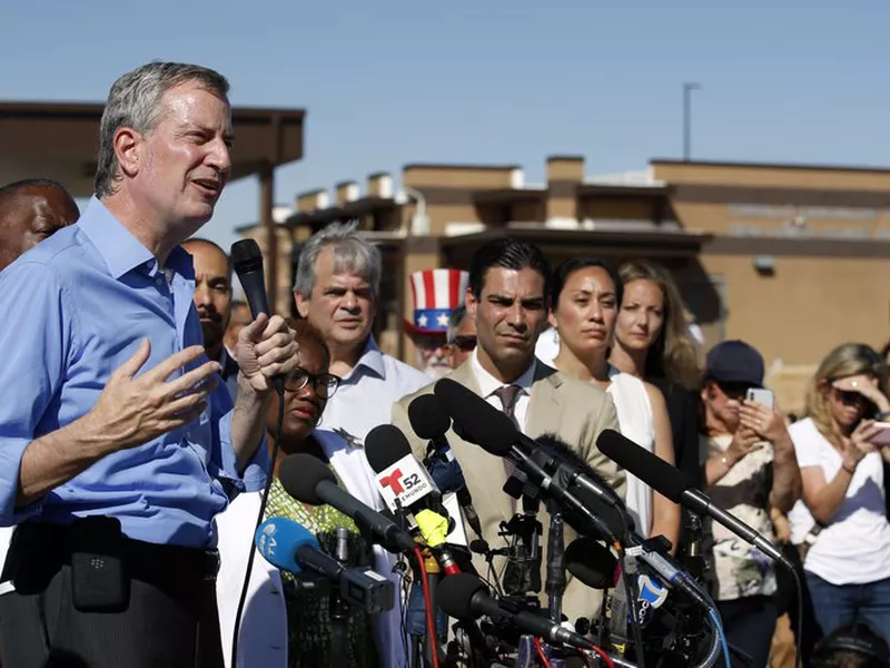 In this Thursday, June 21, 2018, file photo, New York Mayor Bill de Blasio speaks alongside a group of other U.S. mayors during a news conference outside a holding facility for immigrant children in Tornillo, Texas. (AP)