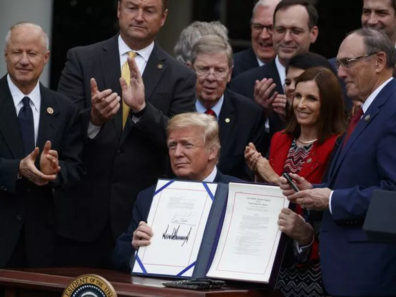 President Donald Trump speaks during a bill signing ceremony for the “VA Mission Act” in the Rose Garden of the White House, in Washington.