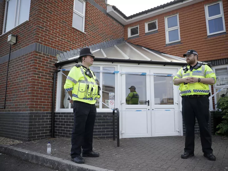 British police officers guards a cordon outside the Amesbury Baptist Centre church in Amesbury, England.