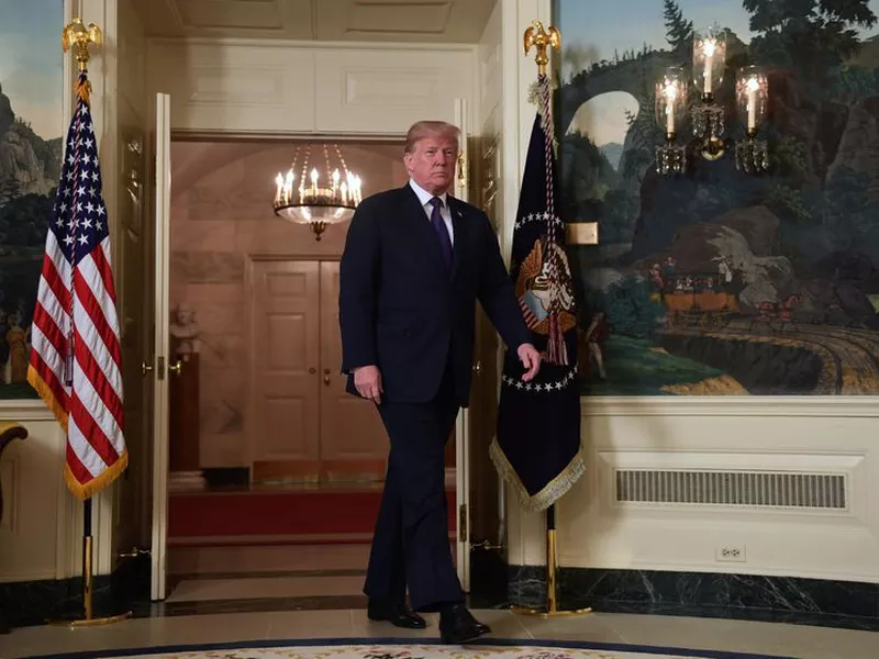 Donald Trump enters to speak in the Diplomatic Reception Room of the White House on Friday, in Washington, about the United States’ military response to Syria’s chemical weapon attack on April 7. (AP).