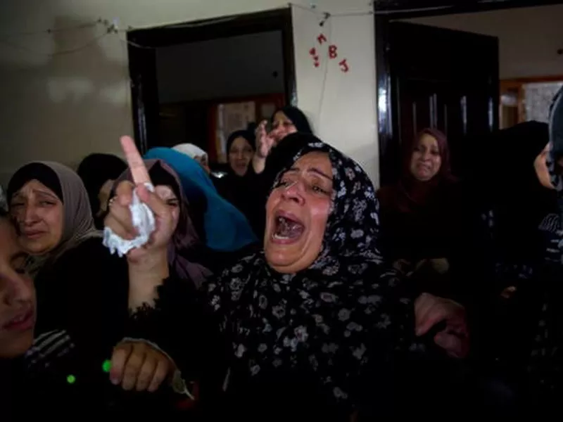 Relatives of 15-year-old Othman Hilles, mourn during his funeral
in the family home in Gaza City.