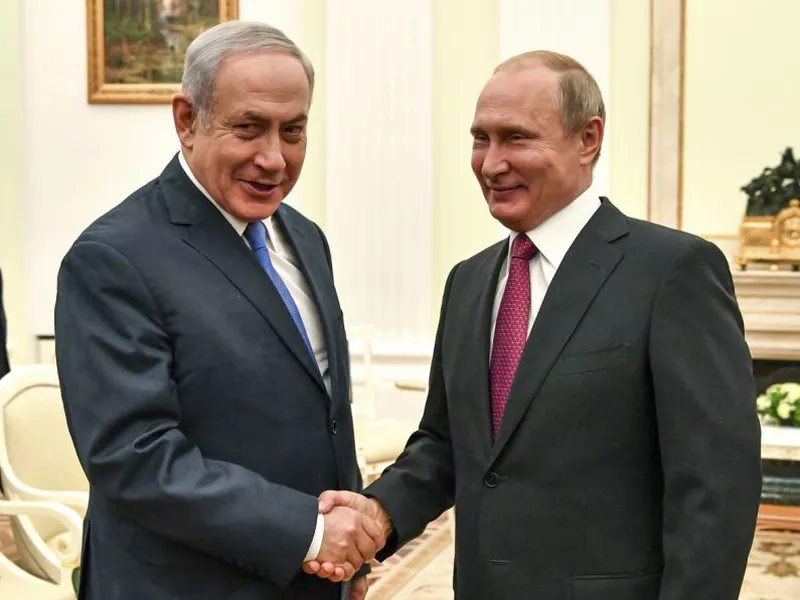 Russian President Vladimir Putin, right, shakes hands with Israeli
Prime Minister Benjamin Netanyahu during their meeting at the Kremlin
in Moscow.