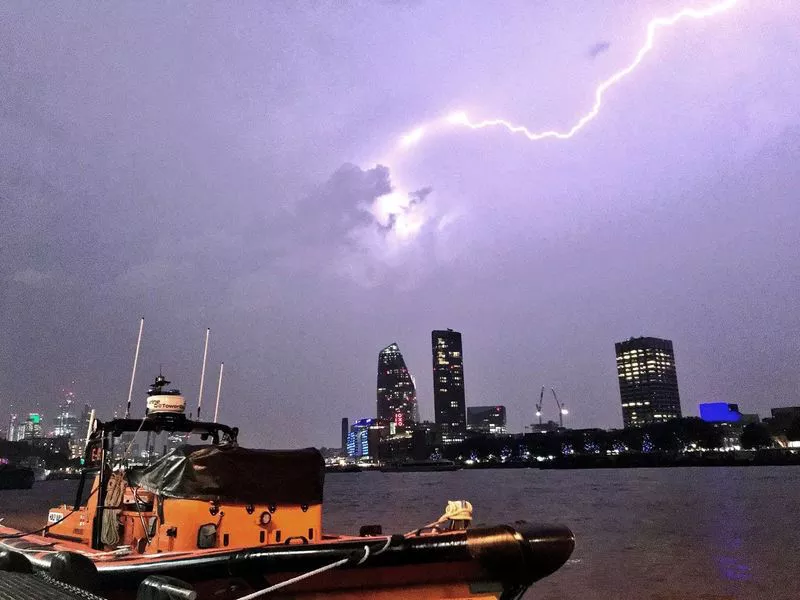 This photo made available by RNLI, shows a lightning strike during a storm in London, Saturday May 26, 2018. British meteorologists say up to 20,000 lightning strikes hit the U.K. during a powerful overnight thunderstorm, and a London-area airport is reporting flight disruptions after an aircraft refueling system was damaged. (Matt Leat/RNLI / AP)