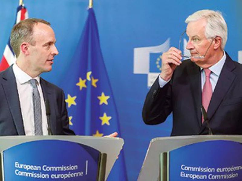 Britain’s newly appointed chief Brexit negotiator Dominic Raab, left, and
EU’s chief Brexit negotiator Michel Barnier, in Brussels.