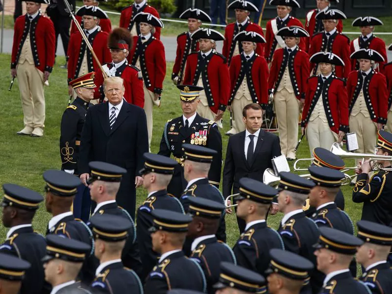President Donald Trump and French President Emmanuel Macron participate in a State Arrival Ceremony on the South Lawn of the White House, in Washington. (Ap)