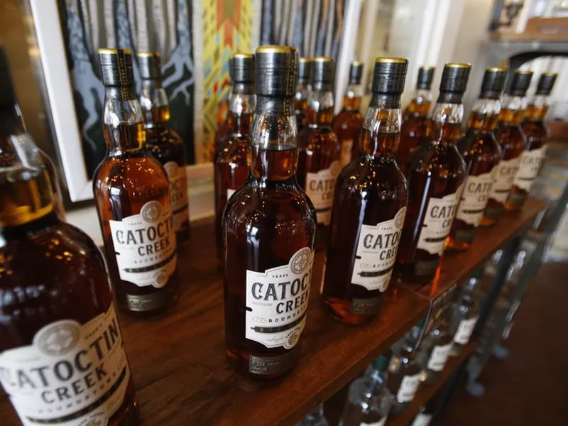Catoctin Creek Distillery whiskey is on display in the tasting room in Purcellville, Va. The European Union on Friday started taxing a range of U.S.