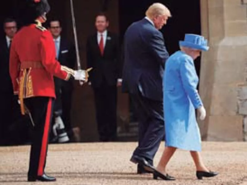 President Donald Trump with Queen Elizabeth II, as they walk out to begin to inspect the Guard of Honour at Windsor Castle in Windsor, England. (AP)