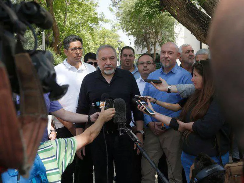 Israeli Defense Minister Avigdor Lieberman (C) talks to reporters during a visit to the Israeli settlement of Katzrin in the Golan Heights. (AP)
