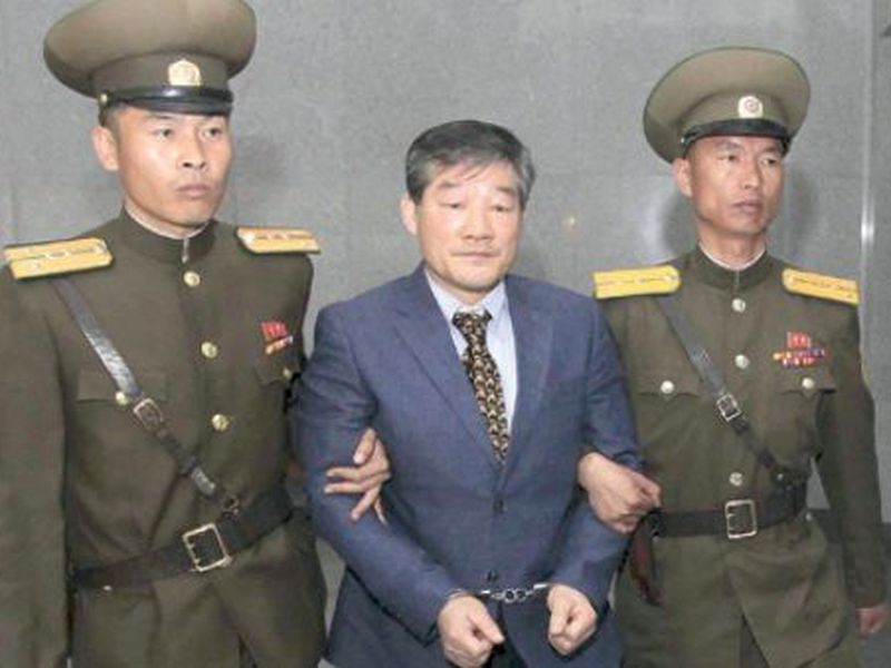 Kim Dong Chul, center, a U.S. citizen detained in North Korea, is escorted to his trial in Pyongyang, North Korea. (AP)