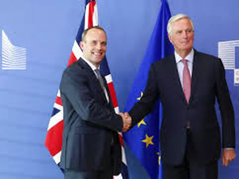 Britain’s newly appointed chief Brexit negotiator Dominic Raab, left, and EU’s chief Brexit negotiator Michel Barnier, in Brussels. (AP)
